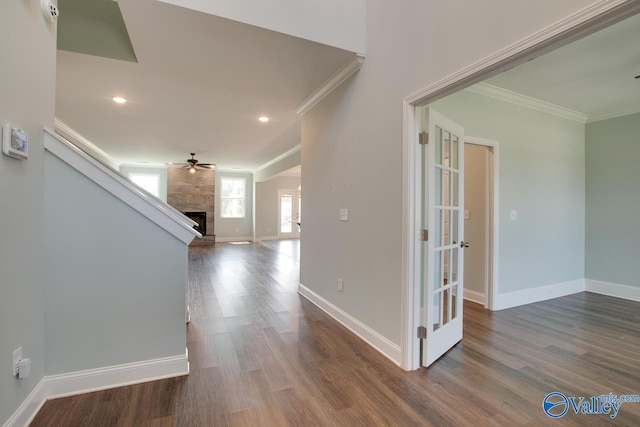 hallway with crown molding, french doors, and dark hardwood / wood-style floors