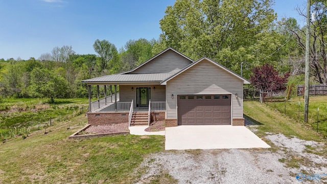 single story home with covered porch, fence, driveway, a front lawn, and an attached garage
