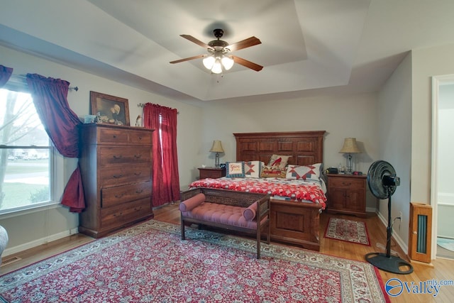 bedroom featuring ceiling fan and light hardwood / wood-style flooring