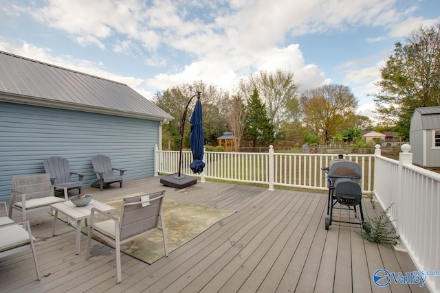 wooden deck with a storage shed