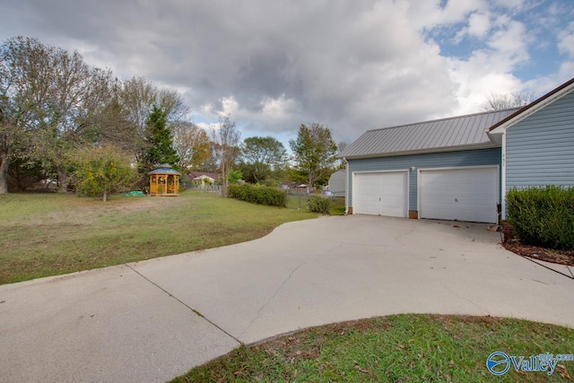 exterior space featuring a garage and a playground