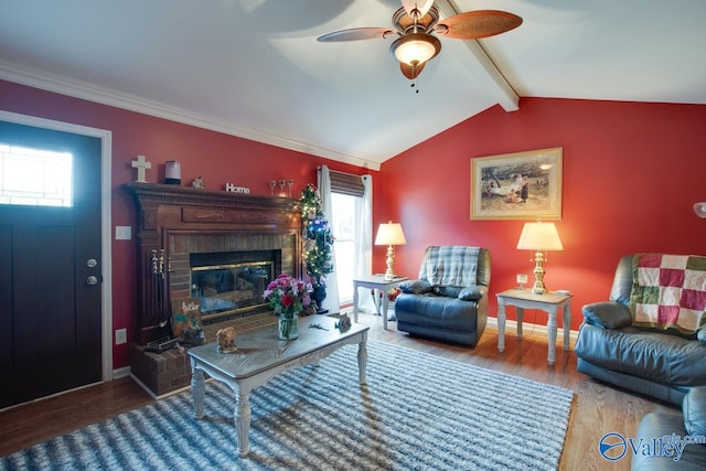 living room featuring a brick fireplace, hardwood / wood-style floors, a healthy amount of sunlight, and ceiling fan