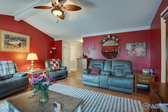 living room with ornamental molding, hardwood / wood-style floors, and lofted ceiling with beams