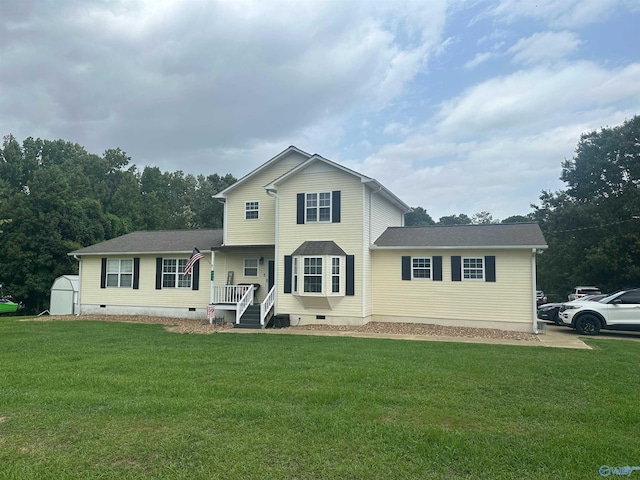 view of front facade with a storage shed, an outbuilding, covered porch, crawl space, and a front yard