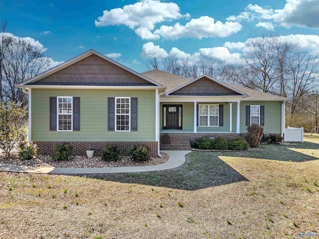 view of front of home featuring a porch and a front yard