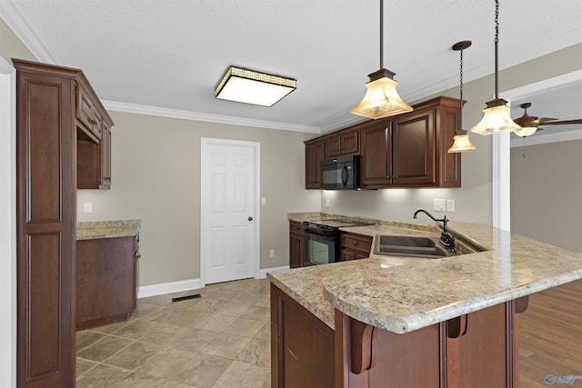 kitchen featuring a breakfast bar area, a peninsula, a sink, black appliances, and crown molding