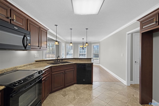 kitchen featuring pendant lighting, ornamental molding, a sink, a peninsula, and black appliances