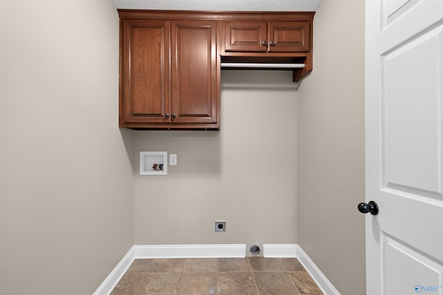 laundry area featuring hookup for a washing machine, cabinet space, baseboards, and electric dryer hookup