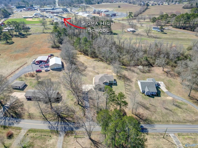 birds eye view of property with a rural view