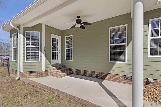 property entrance featuring crawl space, a patio area, ceiling fan, and fence