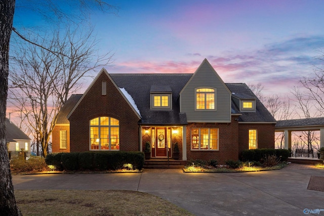 13032 Monte Vedra Rd, Huntsville, AL 35803 - view of front of house with brick siding, roof with shingles, and driveway