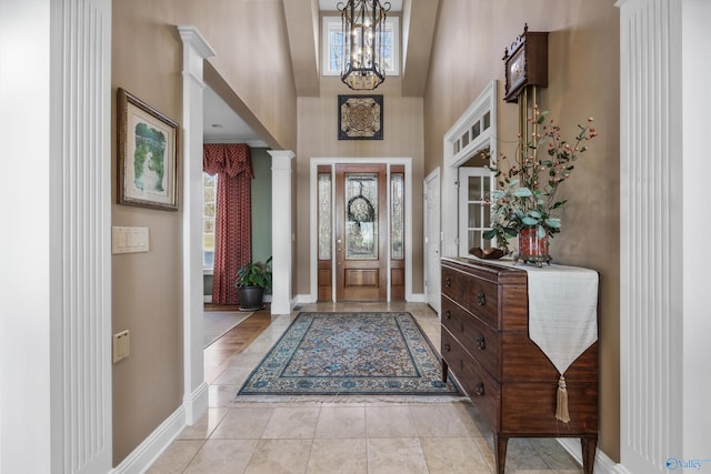 13032 Monte Vedra Rd, Huntsville, AL 35803 - entrance foyer with a chandelier, a high ceiling, baseboards, and decorative columns
