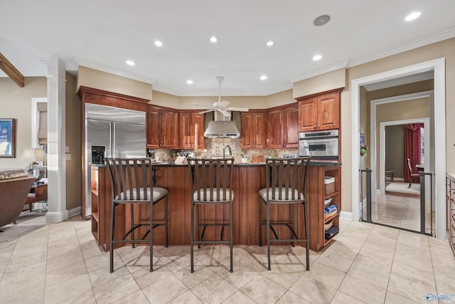 13032 Monte Vedra Rd, Huntsville, AL 35803 - kitchen with stainless steel appliances, dark countertops, recessed lighting, decorative backsplash, and wall chimney range hood