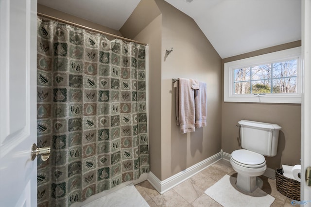 13032 Monte Vedra Rd, Huntsville, AL 35803 - bathroom featuring toilet, curtained shower, baseboards, lofted ceiling, and tile patterned flooring