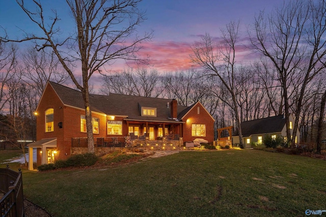 13032 Monte Vedra Rd, Huntsville, AL 35803 - back of house featuring a lawn and covered porch