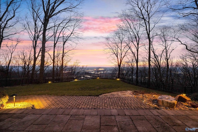 13032 Monte Vedra Rd, Huntsville, AL 35803 - patio terrace at dusk featuring a lawn and a fenced backyard
