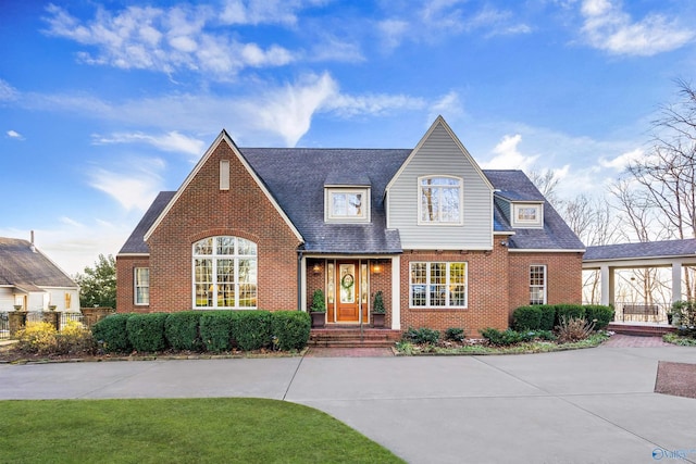 13032 Monte Vedra Rd, Huntsville, AL 35803 - tudor-style house with brick siding and roof with shingles