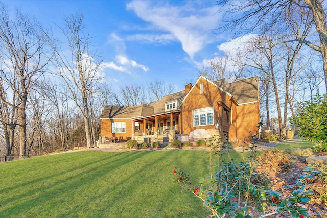 13032 Monte Vedra Rd, Huntsville, AL 35803 - view of front of house featuring a porch, a front lawn, and a chimney