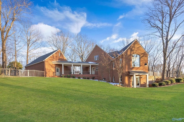 13032 Monte Vedra Rd, Huntsville, AL 35803 - view of front of home featuring brick siding, a front lawn, covered porch, and fence