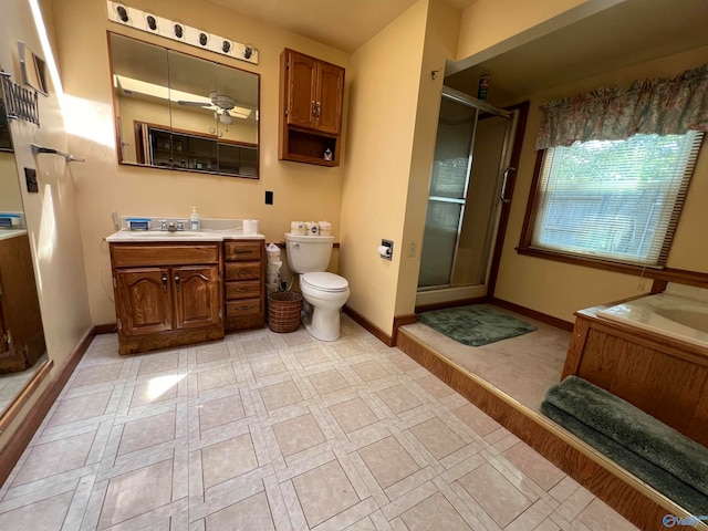 bathroom with toilet, an enclosed shower, vanity, and ceiling fan