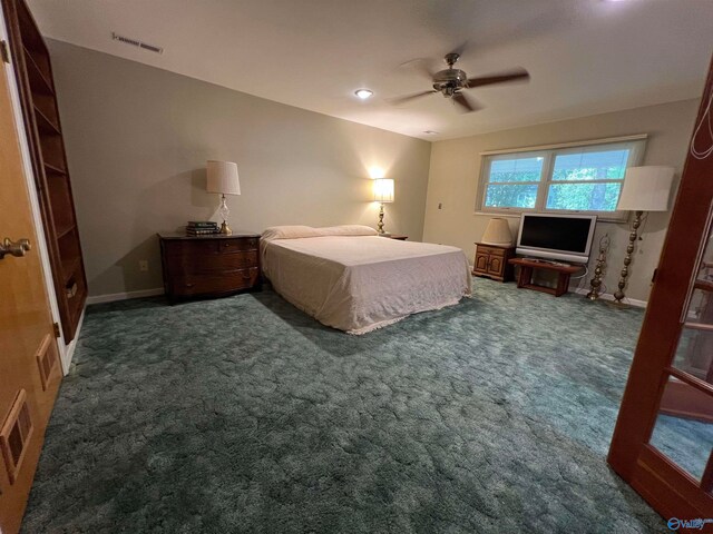 carpeted bedroom featuring ceiling fan