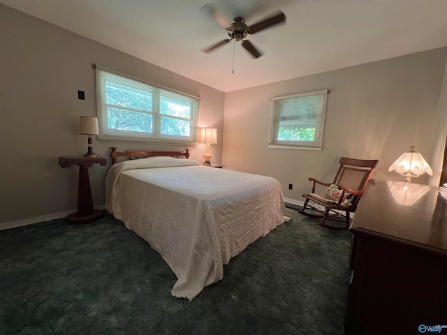 bedroom featuring dark colored carpet and ceiling fan