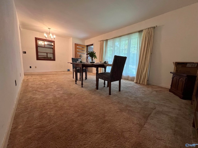 carpeted dining area with an inviting chandelier