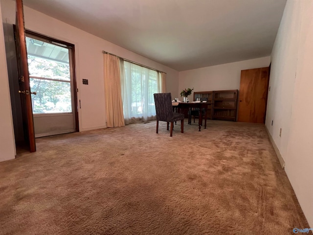 dining space featuring carpet floors and plenty of natural light