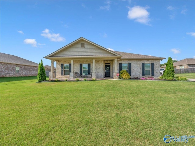 266 Dinner Tree Sq, Huntsville, AL 35811 - craftsman house featuring a front lawn, brick siding, and a porch