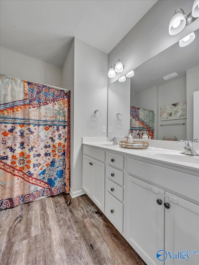 266 Dinner Tree Sq, Huntsville, AL 35811 - bathroom with wood finished floors and double vanity