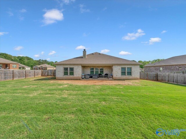 266 Dinner Tree Sq, Huntsville, AL 35811 - back of house with a chimney, a patio area, and brick siding