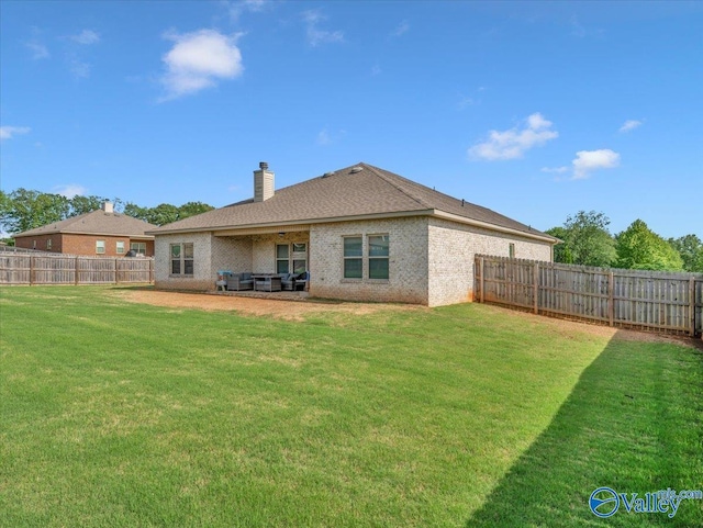 266 Dinner Tree Sq, Huntsville, AL 35811 - rear view of property with brick siding and a chimney