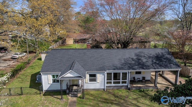 1228 W Market St, Athens, AL 35611 - back of property with a gate, a chimney, a fenced backyard, roof with shingles, and a yard