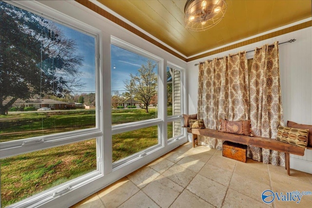 1228 W Market St, Athens, AL 35611 - unfurnished sunroom featuring stone tile flooring and wooden ceiling