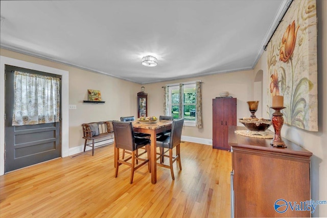 1228 W Market St, Athens, AL 35611 - dining area featuring light wood finished floors, baseboards, and crown molding