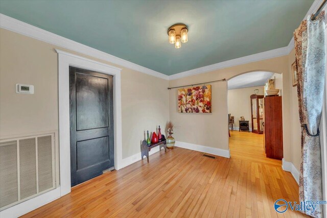 1228 W Market St, Athens, AL 35611 - interior space featuring arched walkways, visible vents, crown molding, and light wood finished floors