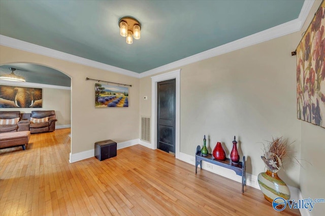 1228 W Market St, Athens, AL 35611 - game room with light wood-style floors, baseboards, visible vents, arched walkways, and ornamental molding