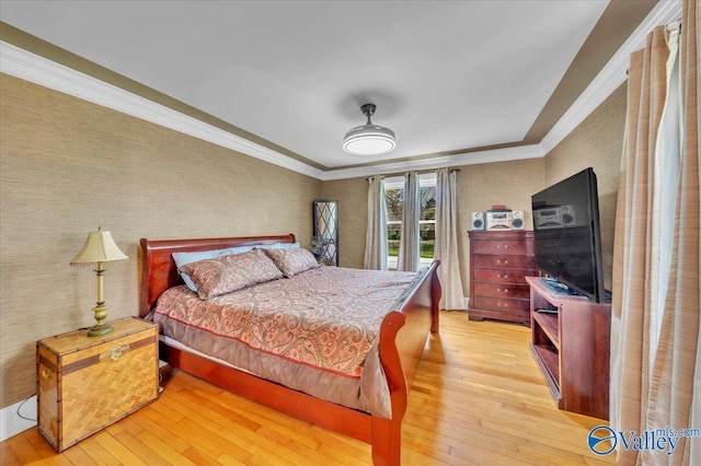 1228 W Market St, Athens, AL 35611 - bedroom with crown molding, light wood-type flooring, and wallpapered walls