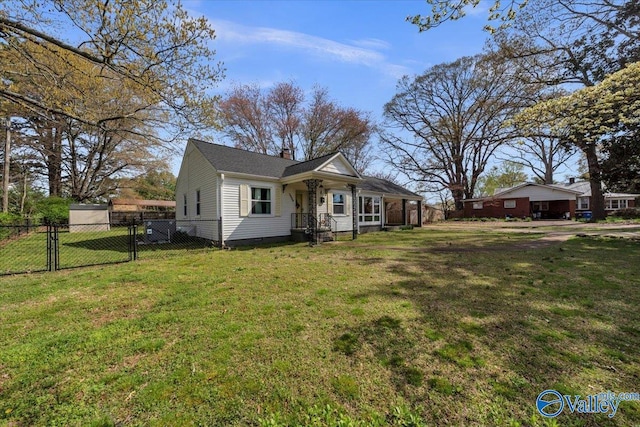 1228 W Market St, Athens, AL 35611 - view of front of house featuring fence, crawl space, a gate, a front lawn, and a chimney