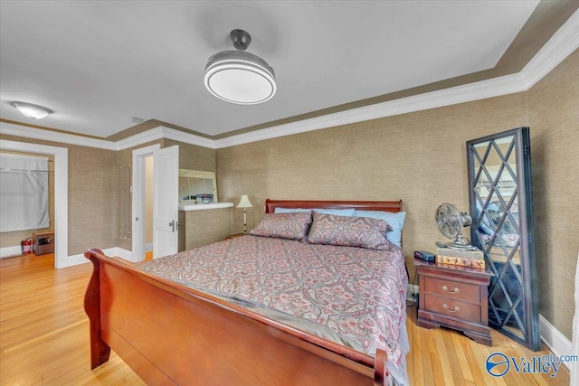1228 W Market St, Athens, AL 35611 - bedroom featuring wallpapered walls, crown molding, baseboards, and wood finished floors