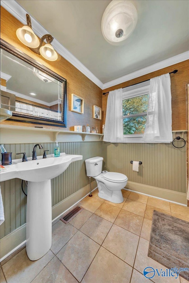 1228 W Market St, Athens, AL 35611 - half bathroom featuring visible vents, crown molding, baseboards, toilet, and tile patterned floors