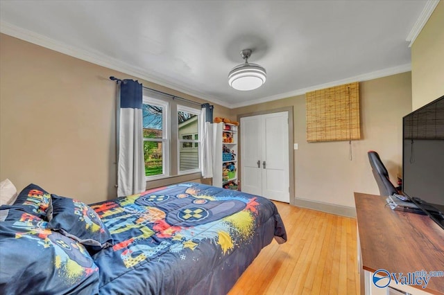 1228 W Market St, Athens, AL 35611 - bedroom with light wood-style flooring, crown molding, and baseboards