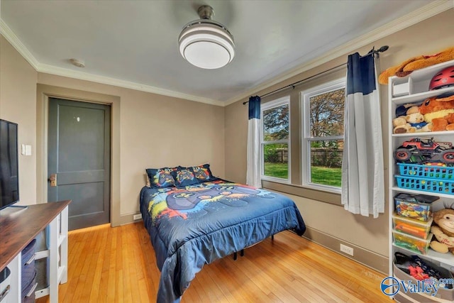 1228 W Market St, Athens, AL 35611 - bedroom with light wood-style flooring, crown molding, and baseboards