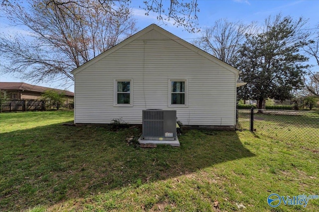 1228 W Market St, Athens, AL 35611 - back of house featuring central air condition unit, fence, crawl space, and a yard