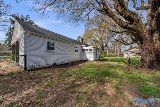 1228 W Market St, Athens, AL 35611 - back of house featuring a chimney, fence, and a yard
