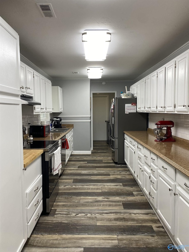 135 Forest Hill Rd, Trinity, AL 35673 - kitchen with stainless steel appliances, white cabinetry, tasteful backsplash, and dark wood-style floors
