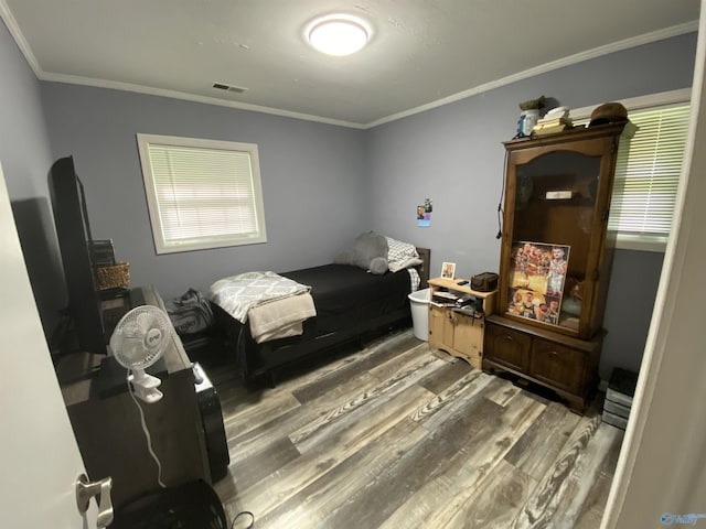 135 Forest Hill Rd, Trinity, AL 35673 - bedroom featuring wood finished floors, crown molding, and multiple windows