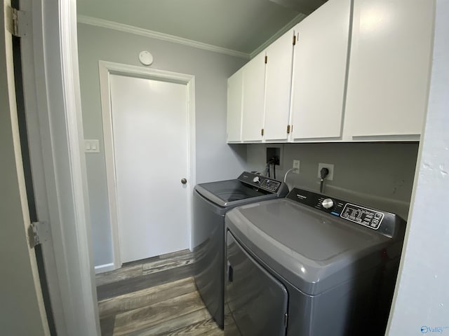 135 Forest Hill Rd, Trinity, AL 35673 - washroom with cabinet space, separate washer and dryer, dark wood finished floors, and crown molding