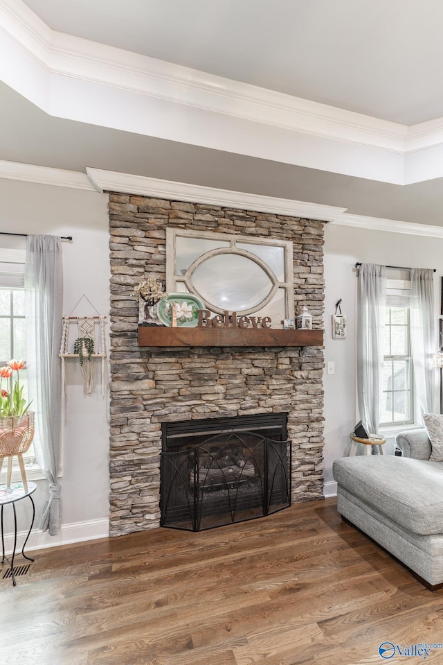 15153 Hobbs Rd, Athens, AL 35614 - living room featuring a fireplace, baseboards, ornamental molding, and wood finished floors