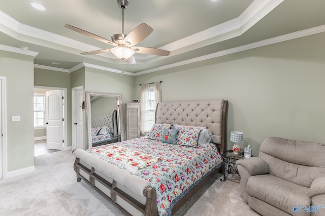 15153 Hobbs Rd, Athens, AL 35614 - bedroom featuring crown molding, ceiling fan, a tray ceiling, light colored carpet, and baseboards